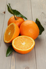 ripe spanish oranges on wood table