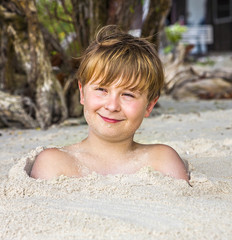 happy young boy  at the beach