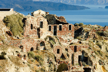 ruins over caldera in Oia village, Greece