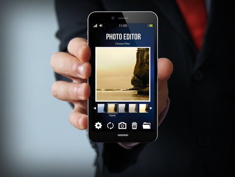 businessman with photo editor smartphone