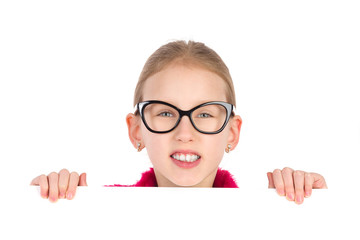 Girl in black glasses behind white placard