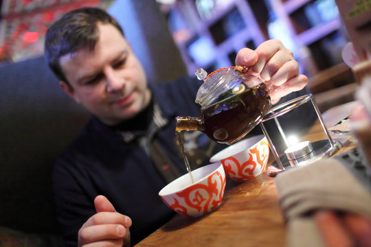 Man Pouring Tea