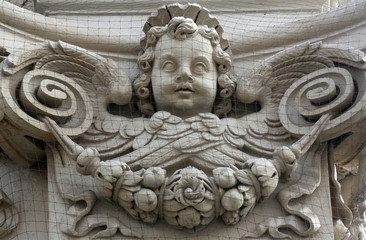 Angel on the facade of Dominican Church in Vienna