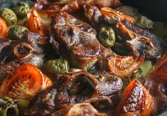 lamb meat roasted with potatoes and vegetables