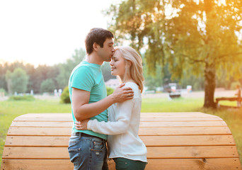 Fototapeta premium Sunny couple in love outdoors, warm tender feelings