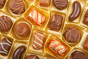 Large box of sweet chokolate candies.