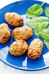 baked meatballs with pepper and spinach
