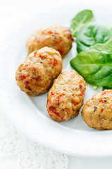 baked meatballs with pepper and spinach