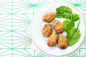 baked meatballs with pepper and spinach
