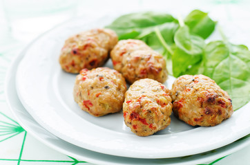 baked meatballs with pepper and spinach