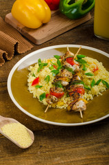 Couscous with vegetables and chicken skewer