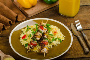 Couscous with vegetables and chicken skewer