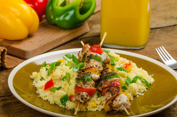 Couscous with vegetables and chicken skewer