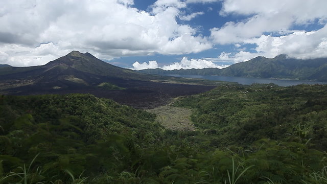 Volcano Batur (left) with clouds in a sky accelerated 64 times. 