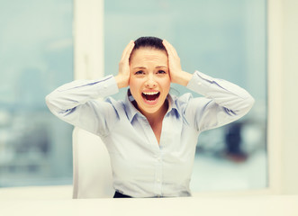 angry screaming businesswoman in office