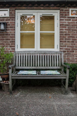 Fototapeta na wymiar Bench and Window in Garden