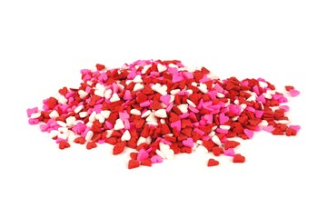 Fototapeta na wymiar Pile of red white and pink Valentines Day candy sprinkles hearts