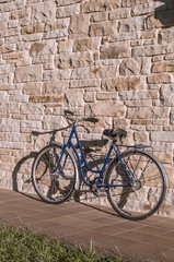 Fototapeta na wymiar Old or classic bicycle on a stone wall