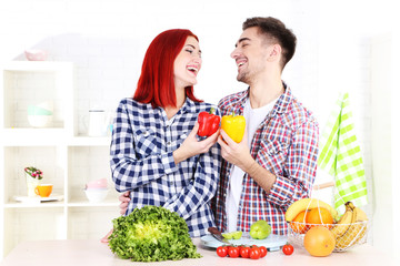 Happy couple together in kitchen