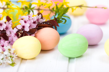 Fototapeta na wymiar Easter eggs and blooming branch
