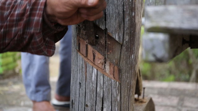 Closeup of Carpenter use equipment to repare the furniture