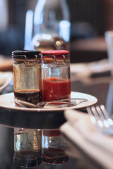 Closeup of two jam jars on the plate