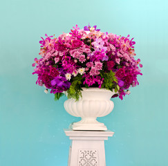 Group of purple flower decorative against light blue walls backg