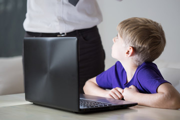 Child using father's laptop