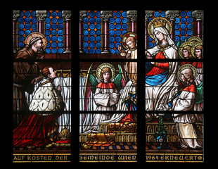Fototapeta premium Virgin Mary with baby Jesus and Saints, Votiv Kirche in Vienna