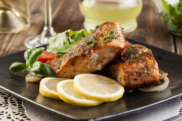 Fried salmon steak with vegetables