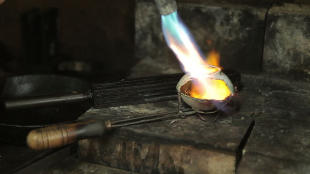 video footage of melting dowm metal in a Jewelry, metal burn