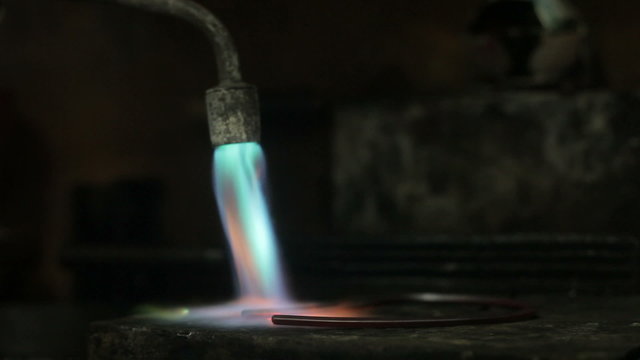 video footage of melting dowm metal in a Jewelry, metal burn