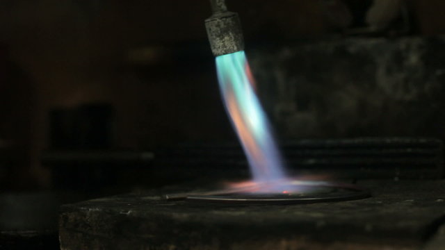 video footage of melting dowm metal in a Jewelry, metal burn