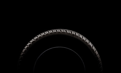 Car tires. Winter wheel profile structure on black background - obrazy, fototapety, plakaty