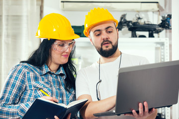 Craftsman, craftswoman with laptop and planner,selective focus