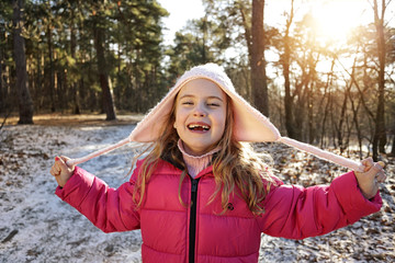 smilling young girl in a winter sunny day