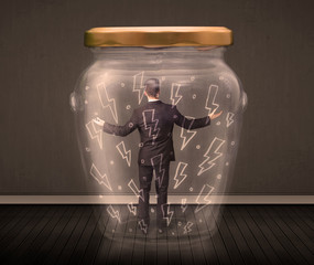 Businessman inside a glass jar with lightning drawings concept