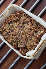 Piece of whole grain bread on grill.