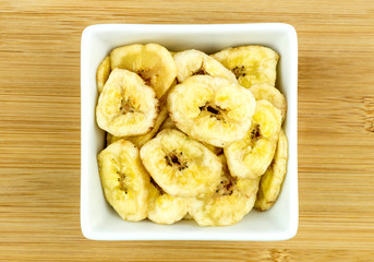 Tasty banana chips in bowl