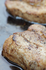 Pieces of cured pork fried on wok.