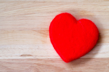 Valentines Day background red heart on wooden background