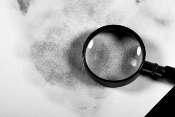 Fingerprint on white paper.