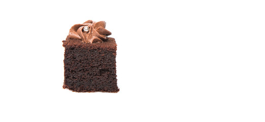 Bite sized chocolate cake with icing on top over white 