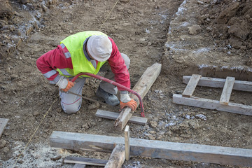 cutting wooden beam for formwork