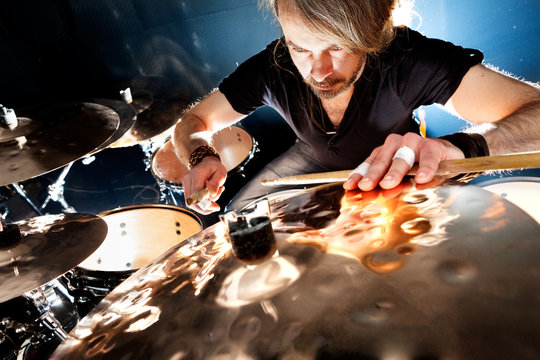 Man playing the drum.Live music background concept.Drummer