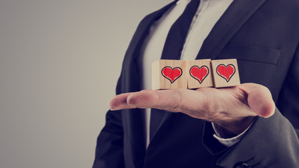 Wooden alphabet blocks with a hand-drawn red heart