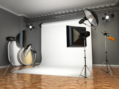 Photo studio with lighting equipment. Flashes, softboxes and ref