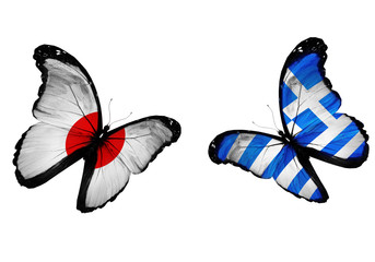 Concept - two butterflies with Greek and Japan flags flying