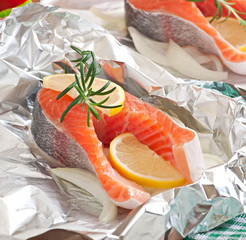 Prepared to bake in foil trout with onion and lemon