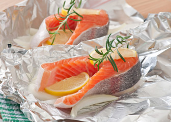 Prepared to bake in foil trout with onion and lemon